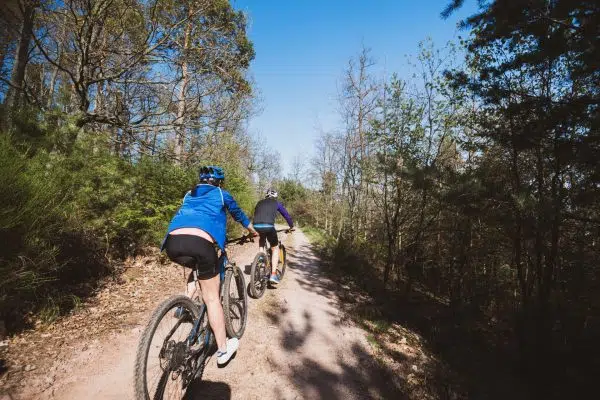 senior couple enjoying a ride in French Vosges mountains Rear view of unrecognizable senior couple enjoying a ride in French Vosges mountains on a calm clear with blue sky day